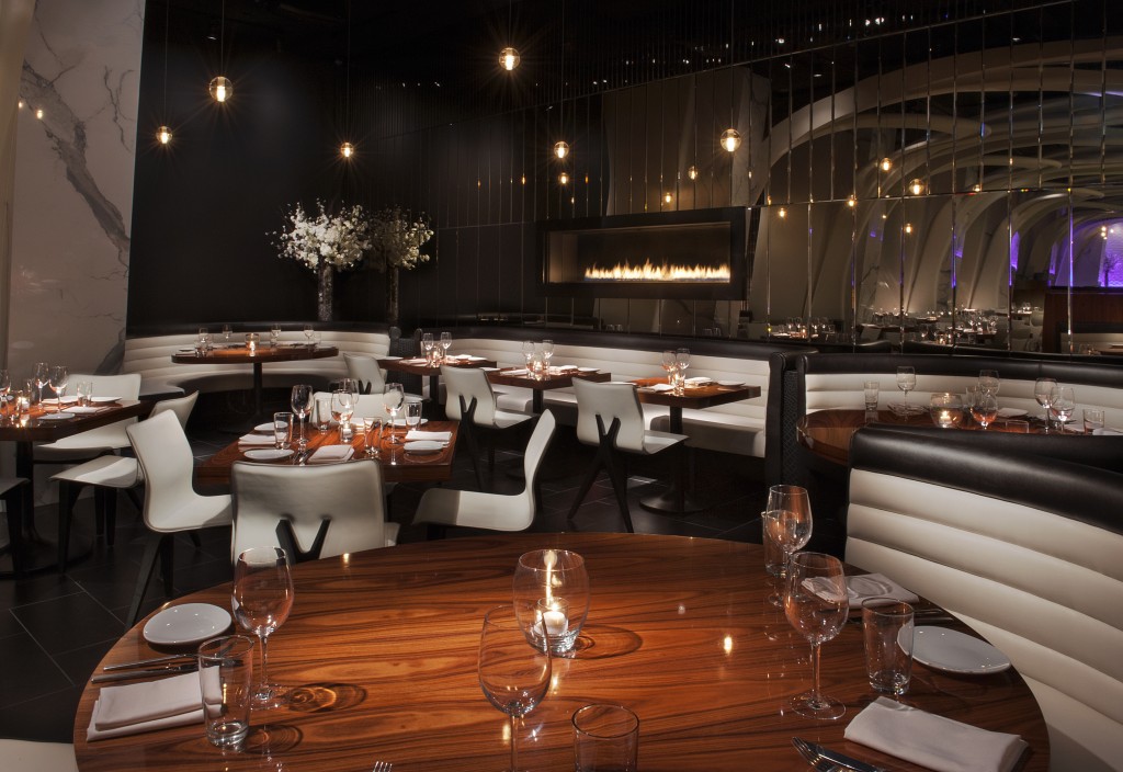 STK - Orlando location interior dining room featuring fully laid tables