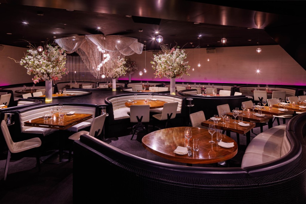 An interior shot of circular booths at STK Strand